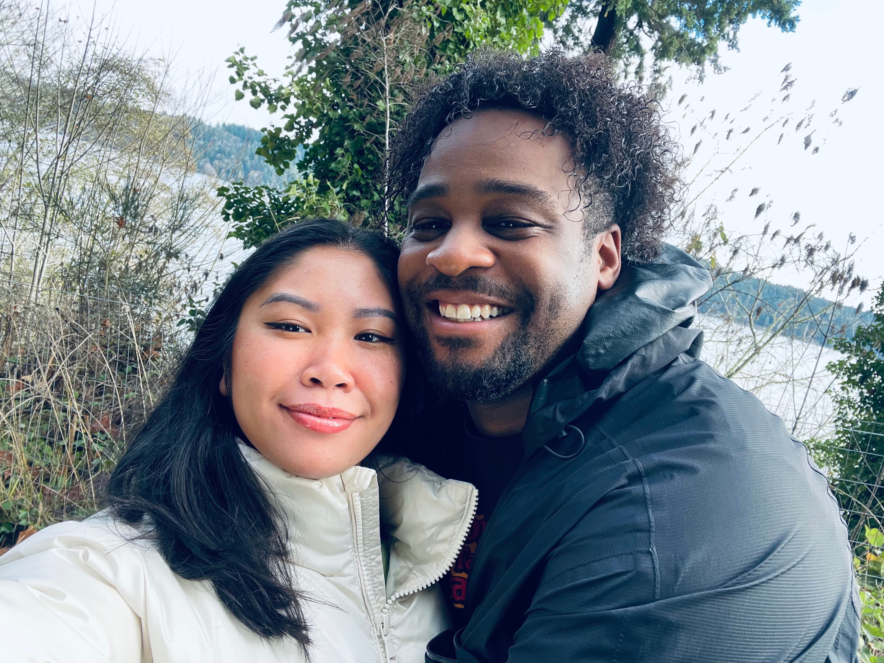 By the water, bundled up